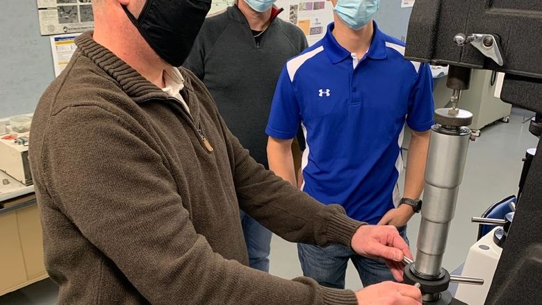 Testing powder metal samples in the Penn State DuBois engineering labs. 