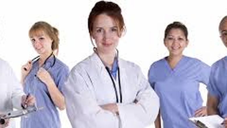 Five healthcare workers with smiling faces