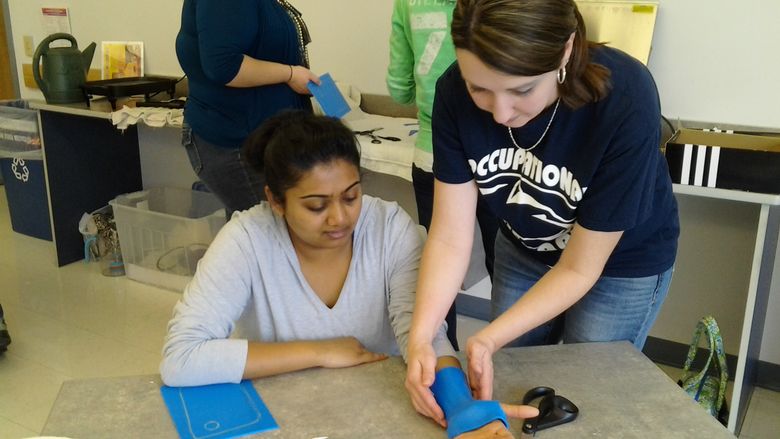 In OT 206, students participate in a hands-on splinting skills workshop.