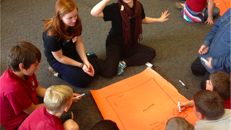 Six young adults in a circle talking
