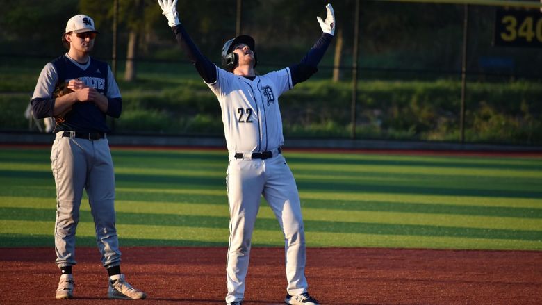 Baseball player celebrating after getting on base