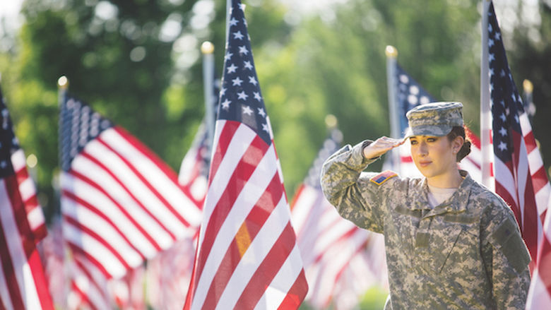Female Army veteran and flags