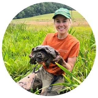 Terra Haines holding a turtle