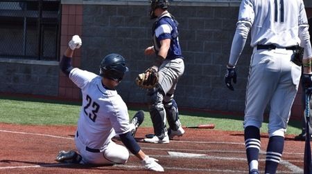 DuBois baseball player sliding into home to score a run