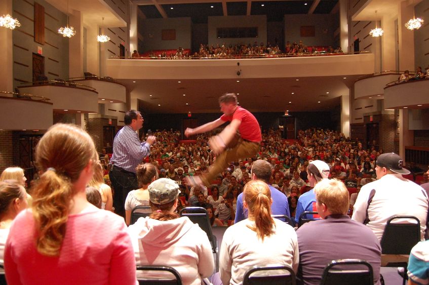 Hypnotist Keith Karkut hypnotizes a student during a performance