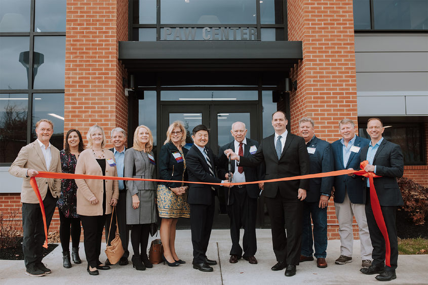 Ribbon cutting in front of the PAW Center building at Penn State DuBois