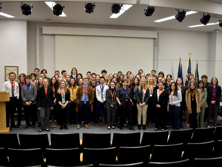 Medal winners from the 2022 Pennsylvania DECA district one conference gather in Hiller Auditorium during the awards ceremony.