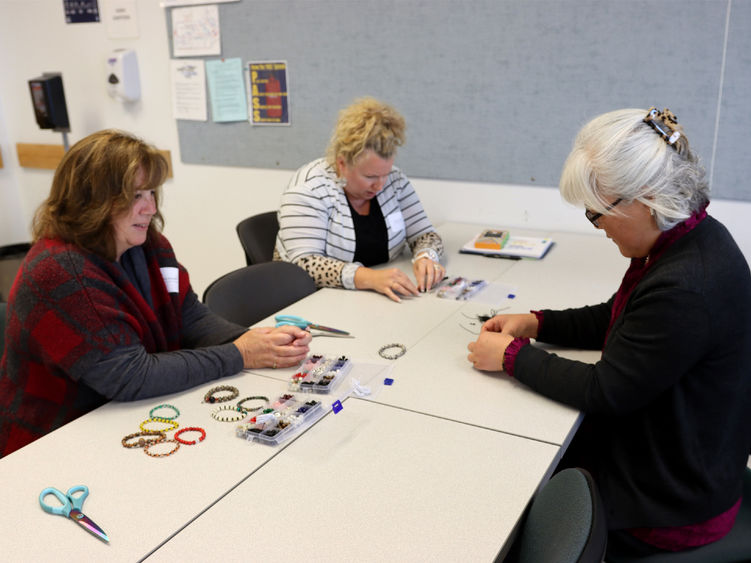 Hyeseon Kim, community outreach coordinator for the institute for Korean studies, right, leads Diana Kreydt, student advocacy specialist, and Selena Price, lecturer in criminal justice, through an exercise during the DEIB workshop held at Penn State DuBois in October.