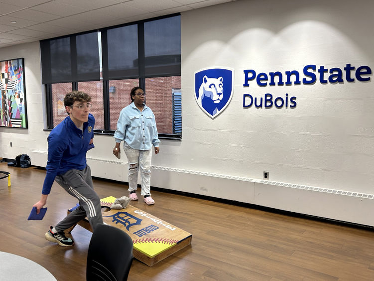 Penn State DuBois students Joey Morrison and Ay Adedeji playing cornhole during the recent game night event in the student union