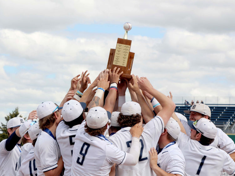 The Penn State DuBois baseball team lifts the PSUAC championship trophy as a team after winning the championship on Monday
