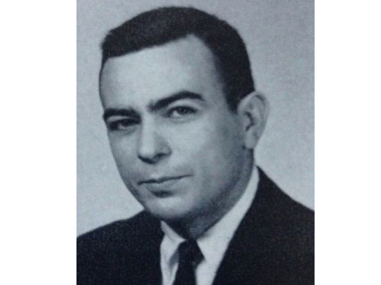 A 1961 yearbook photo portrait of Frank A. Palmerino