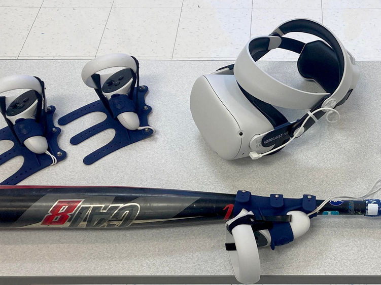 The virtual reality headset and controllers, including one attached to a bat, that are used for baseball and softball hitting practice using software available through the NCPA LaunchBox, powered by Penn State DuBois.