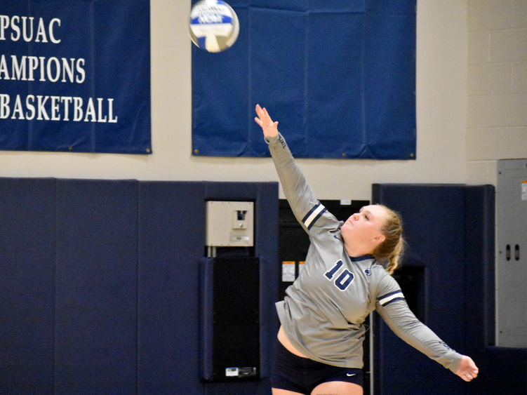 Penn State DuBois senior Paige Pleta follows through on her strike during the home match against Penn State New Kensington at the PAW Center.