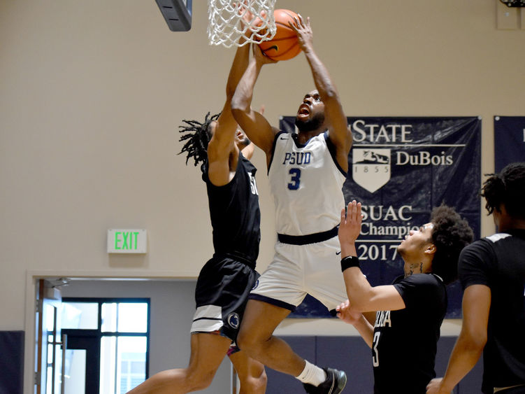 Penn State DuBois senior guard Jaiquil Johnson attempts a put back shot in the paint, with defenders all around him, during a recent game played at the PAW Center.