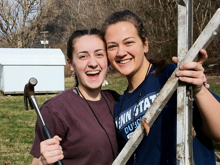 Penn State DuBois students Tayler Rafferty, left, and Hannah Thompson, right, pause for a moment for a picture during their service trip to Kentucky as part of a group from Christian Student Fellowship at Penn State DuBois.