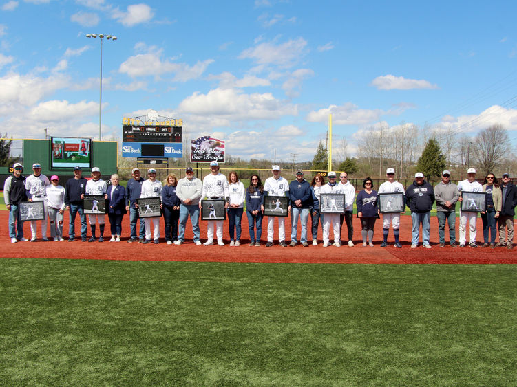 The senior members of the baseball team at Penn State DuBois, along with their family members, during their senior day recognition at Showers Field in DuBois.