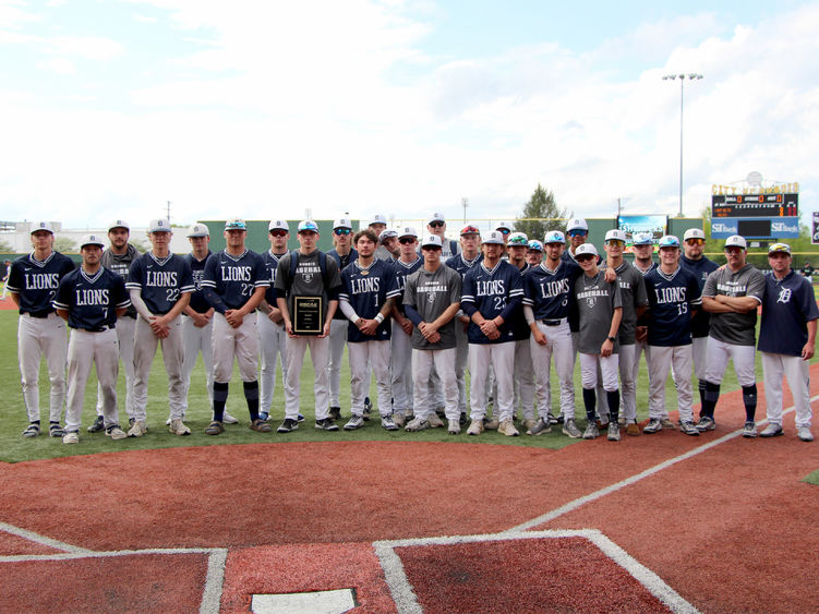 The Penn State DuBois baseball team stands for a group picture with the third-place plaque during the USCAA Small College World Series at Showers Field in DuBois.