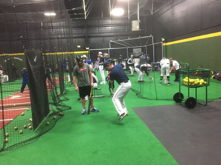 Coaching youth at baseball clinics