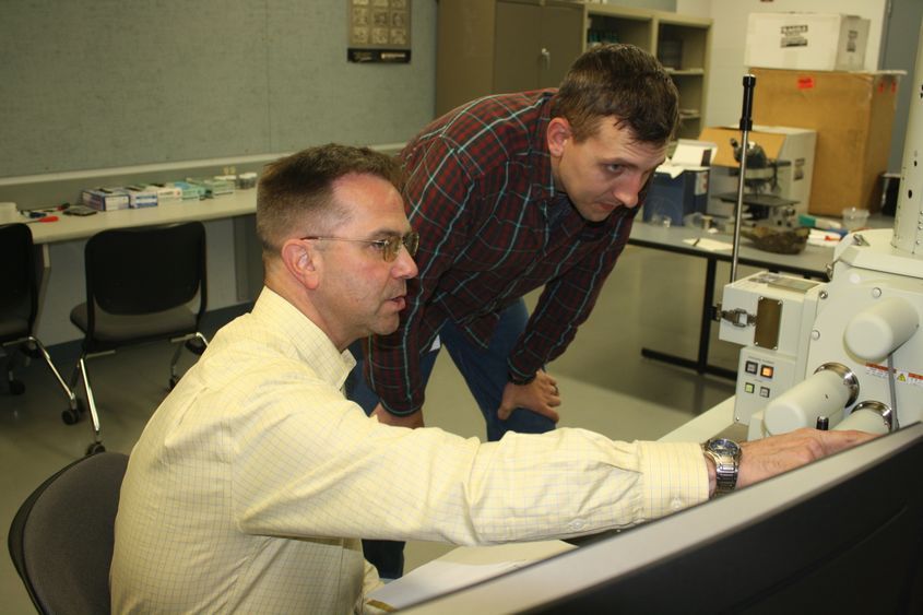 Instructor in Engineering Stephen Feldbauer, seated, and student Kyle Bear. 