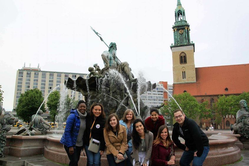 The group captured this photo at Neptune Fountain, in front of Rotes Rathaus (the city hall in Berlin).