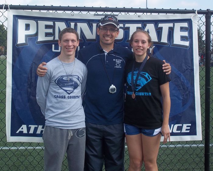 Coach Kyle Gordon, center, with runners Mathew Burke and Juliann Boddorf 