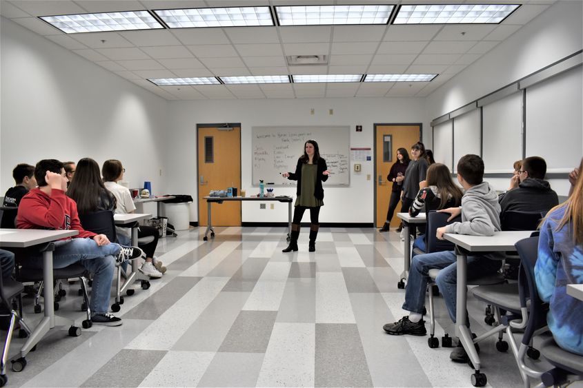 Lecturer in Human Development and Family Studies Jessica Clontz , at center, leads a workshop for students in gifted programs at area school districts. 