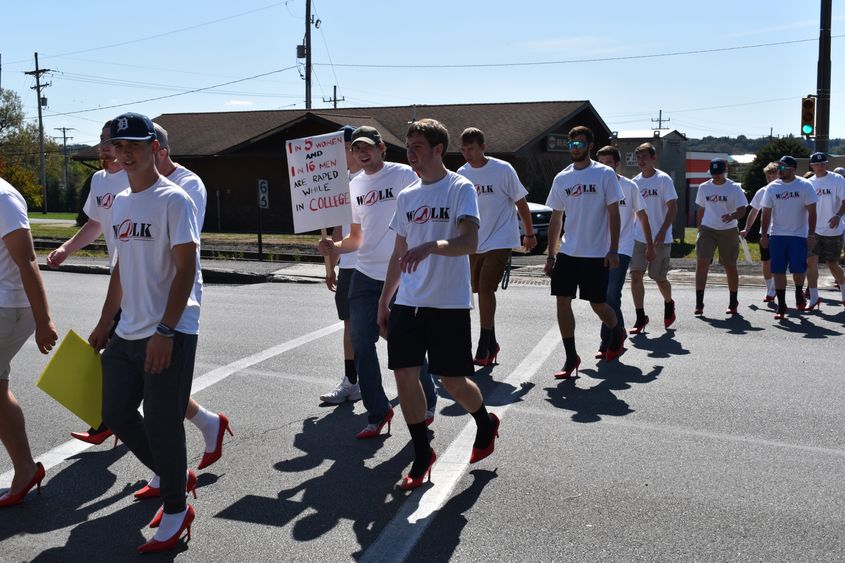 Men walking in high heals.