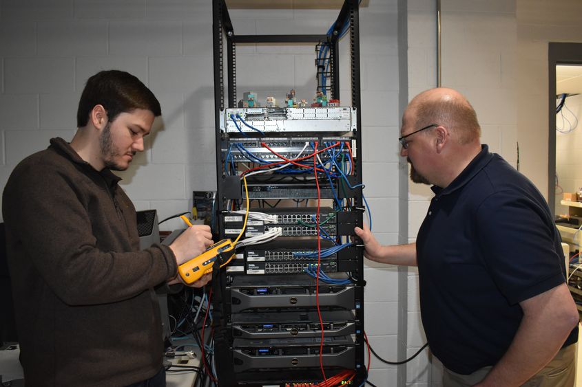 IST graduate CJ Seitz, left, and IST Program Leader Jason Long. 