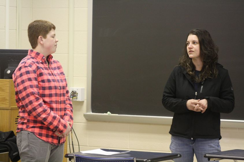 Student Kristy Hanes, left, ponders her next question 