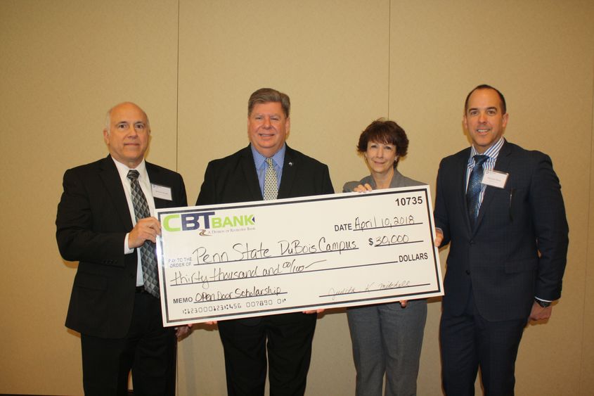 CBT representatives present a check to Chancellor McBride. 