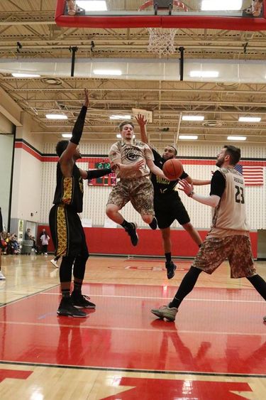Tristan Pierce and Sam Roselli in action on the court.