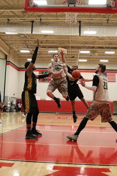 Tristan Pierce and Sam Roselli in action on the court. 