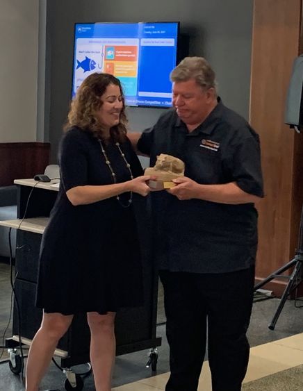 DEF President Kristen Vida recently presented Penn State DuBois Chancellor M. Scott McBride with a Nittany Lion statue recognizing his service to the campus. 