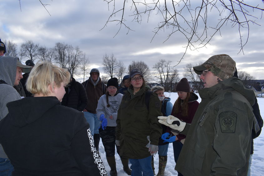 Pennsylvania State Game Warden Thomas Henry led students in a simulated investigation of the illegal killing of a deer.  