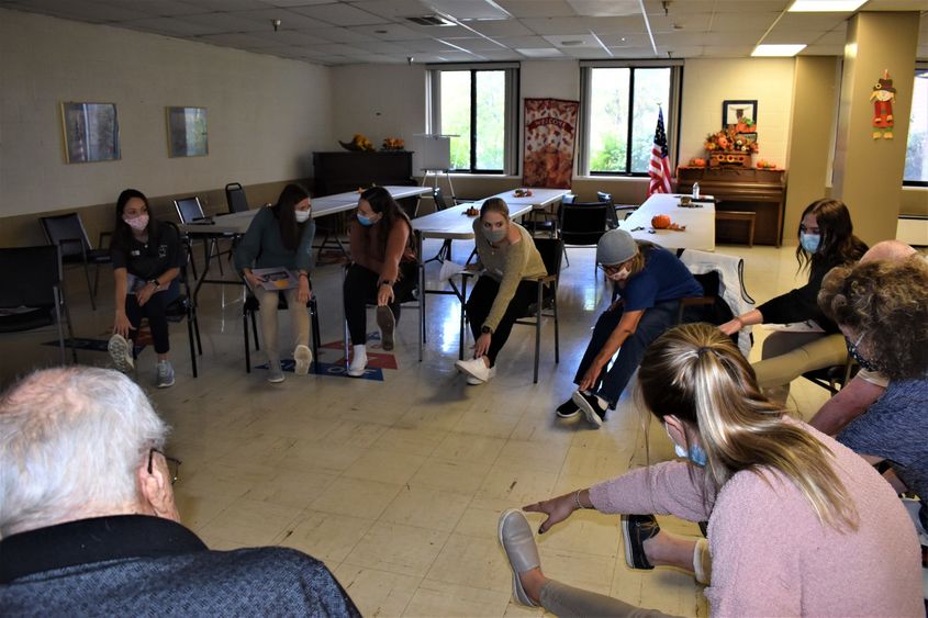 Penn State DuBois Occupational Therapy Assistant students lead area senior residents in fall prevention exercises.  
