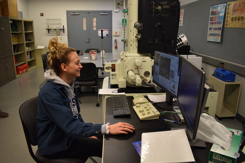 Penn State DuBois Engineering Student Nicolette Brossard examines properties of powder metal material under a scanning electronic microscope. 