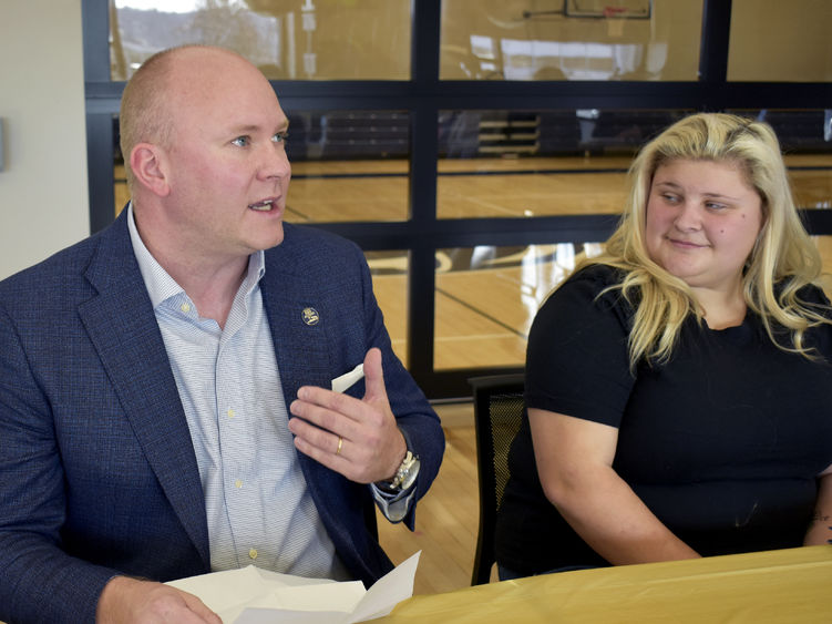 John Peterson connects with Sydney Brown, a graduating wildlife technology student at a celebratory lunch. 