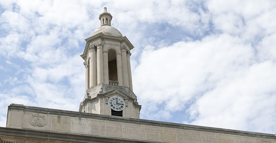 Old Main Bell Tower against Blue and White Sky