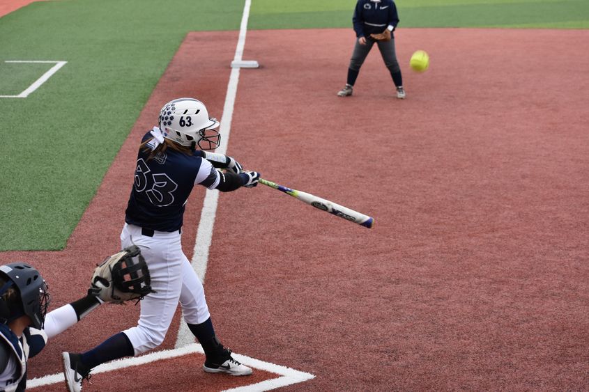 A batter taking a swing. 