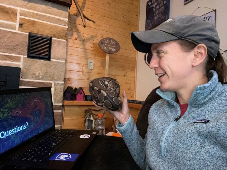Assistant Teaching Professor of Wildlife Technology Emily Thomas with her pet python, Zeus.