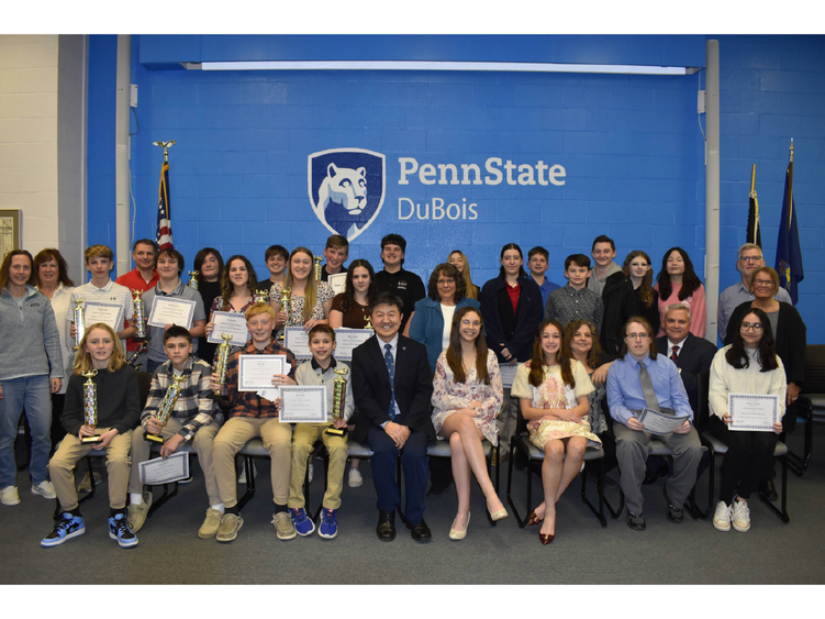 Competing teams, judges, and staff gather for a photo at the 25th Annual Junior Scholastic Challenge